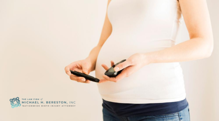 Pregnant woman checking her blood sugar levels.